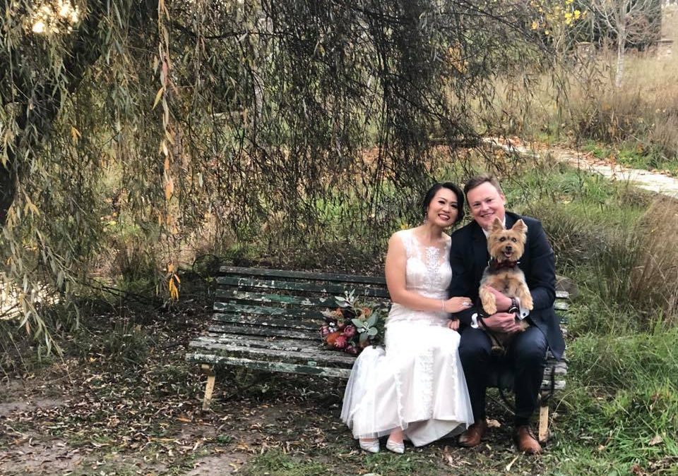 Bride and groom with their dog